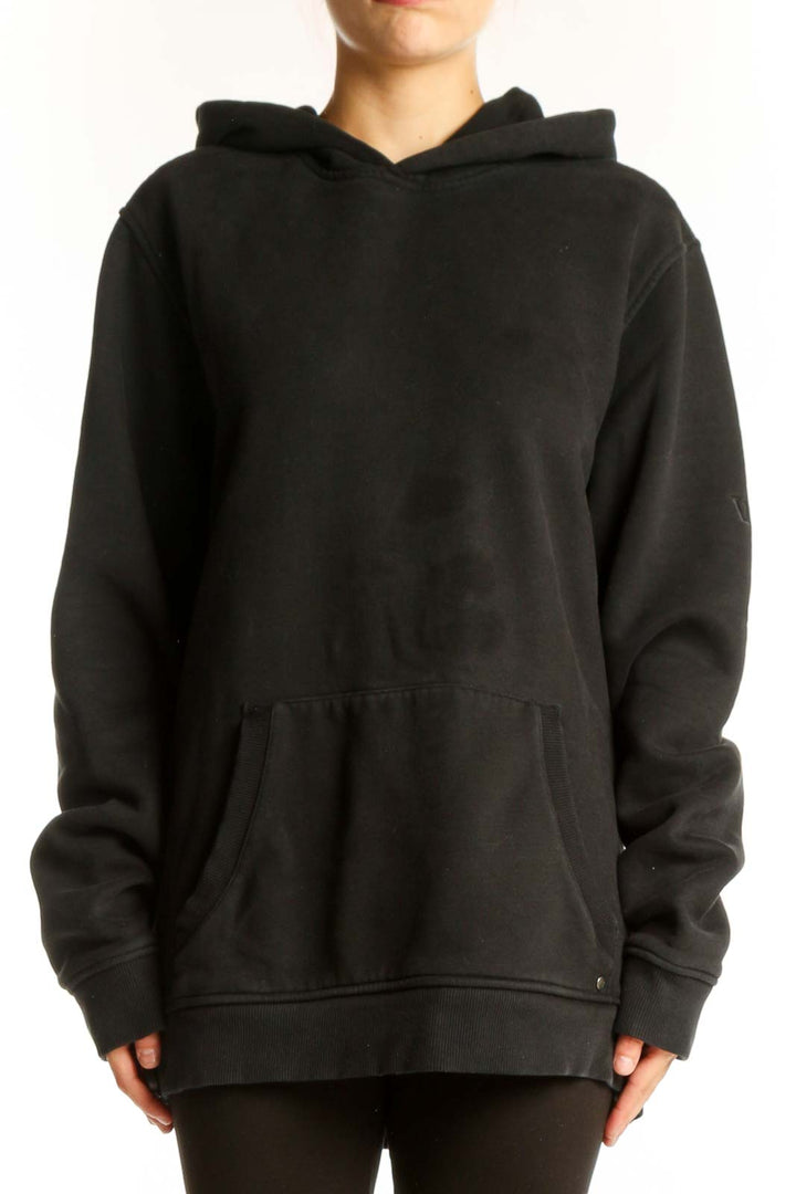 Front view of black Vuori oversized hoodie with kangaroo pocket