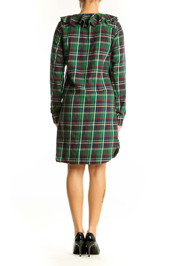Side view of Ralph Lauren green plaid cotton shirt dress showing curved hemline