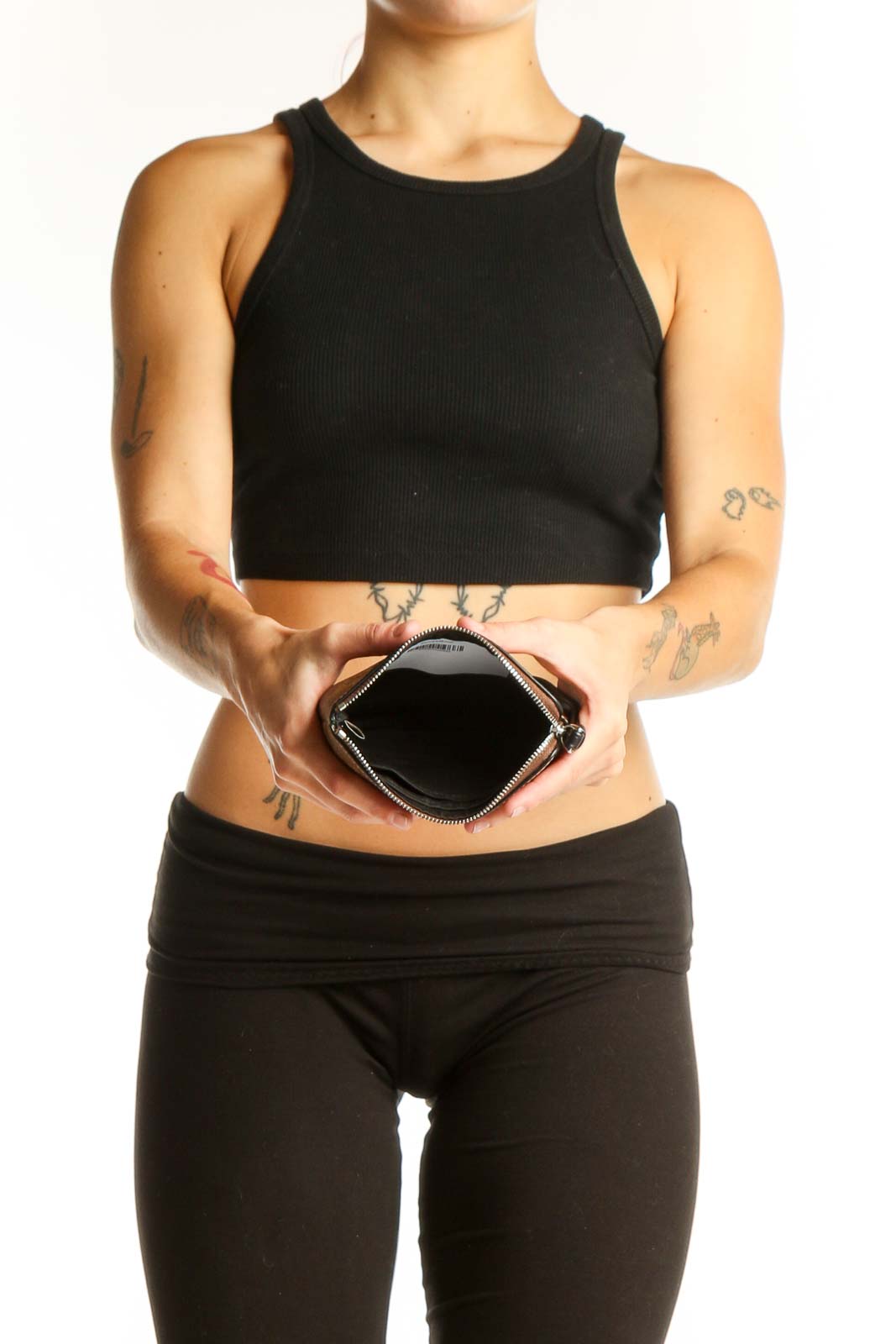Coach wristlet held by model showcasing size and style