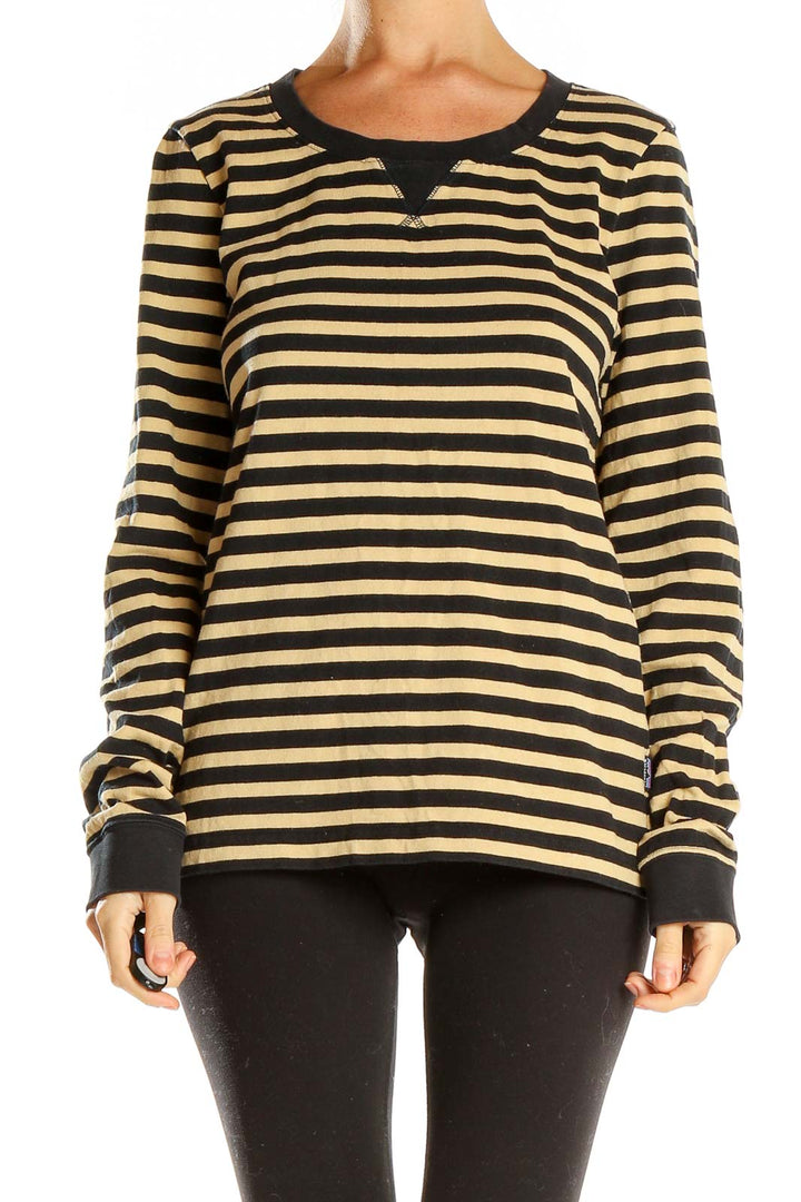 Front view of Patagonia black and tan striped long sleeve knit top