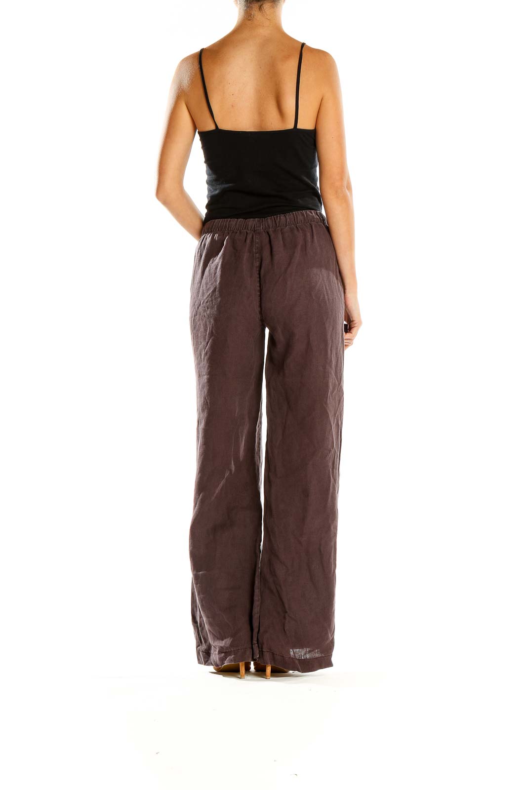 Side view of model wearing Joie brown wide-leg linen pants