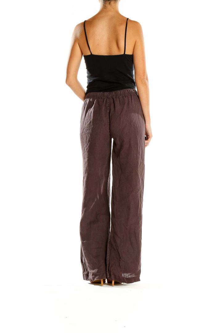 Side view of model wearing Joie brown wide-leg linen pants