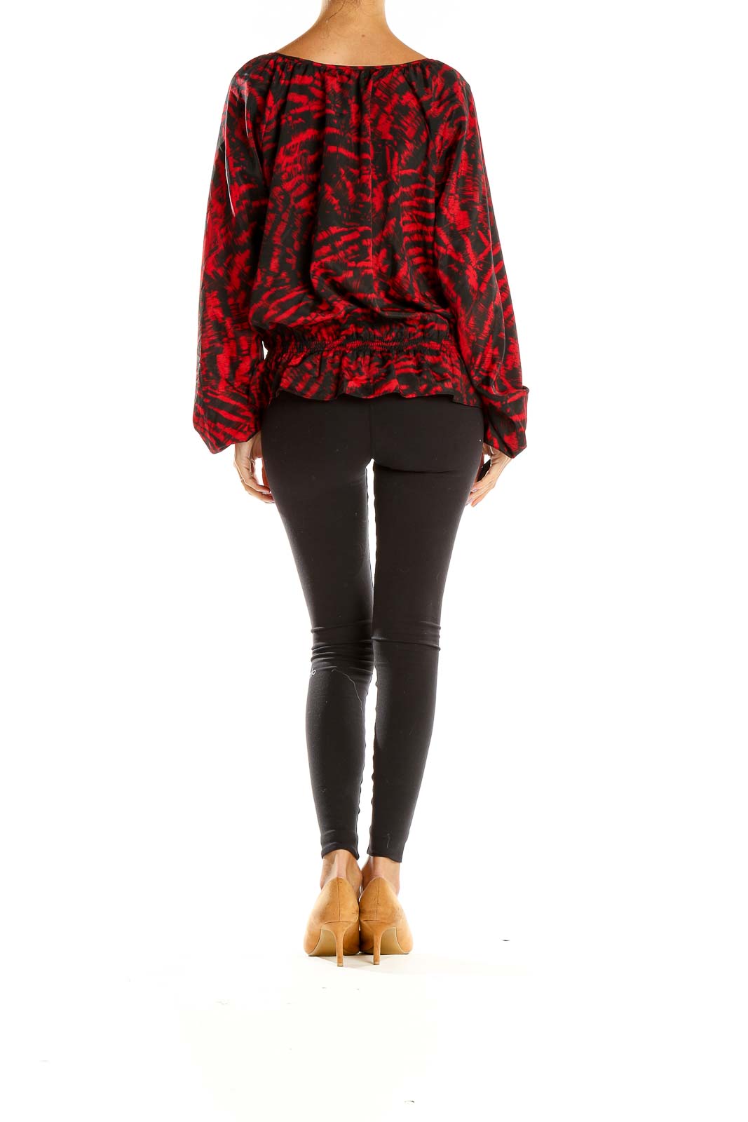 Side view of MICHAEL Michael Kors red abstract print blouse with black pants
