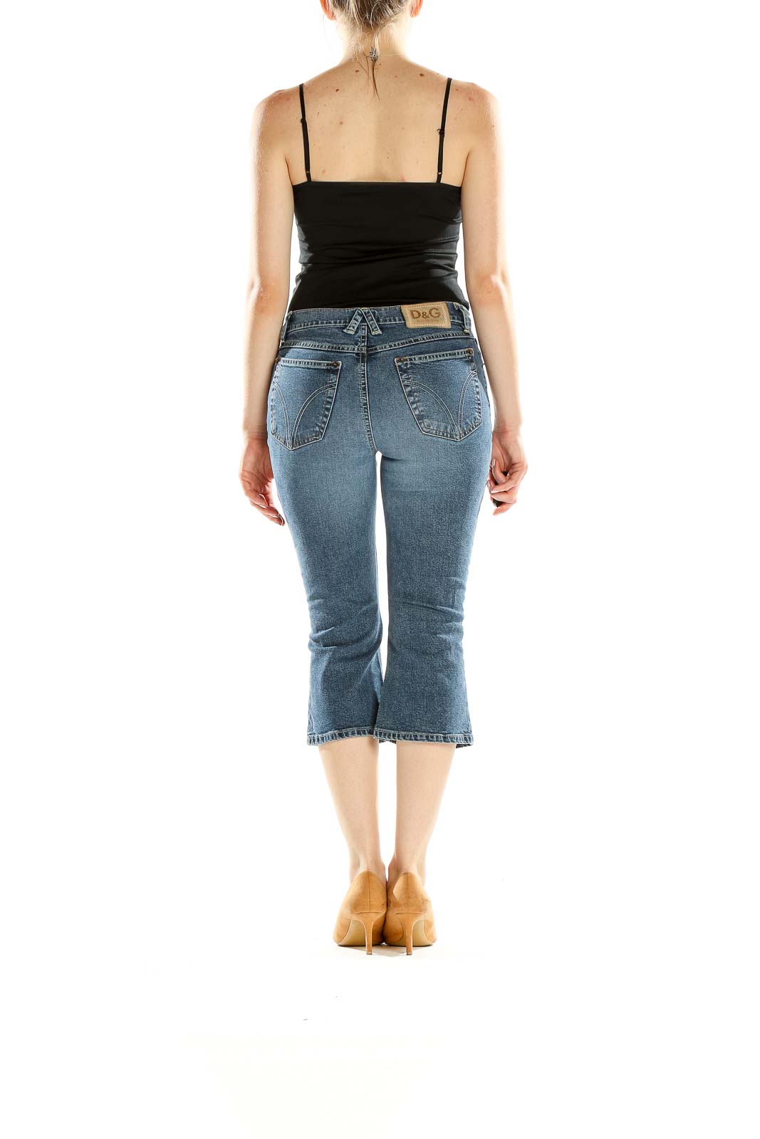 Back view of D&G blue cropped denim capri jeans on model