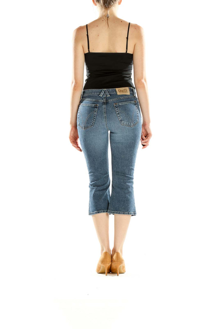 Back view of D&G blue cropped denim capri jeans on model