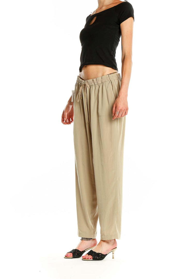 Front view of beige relaxed fit drawstring pants by Jones New York