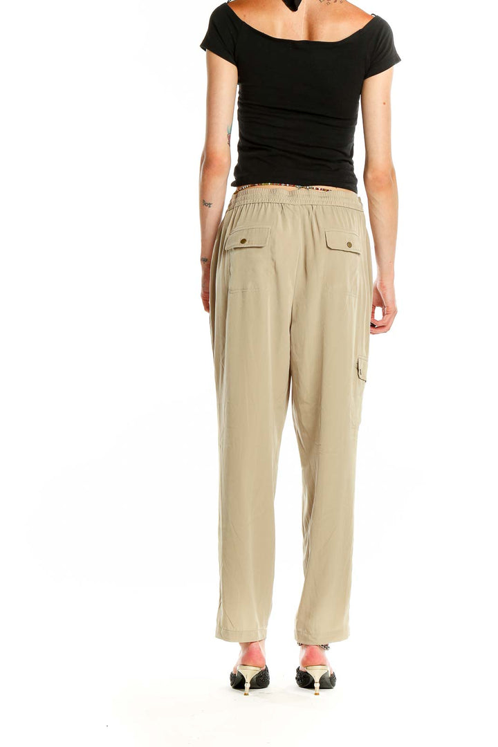 Side view of beige relaxed fit drawstring pants by Jones New York on model