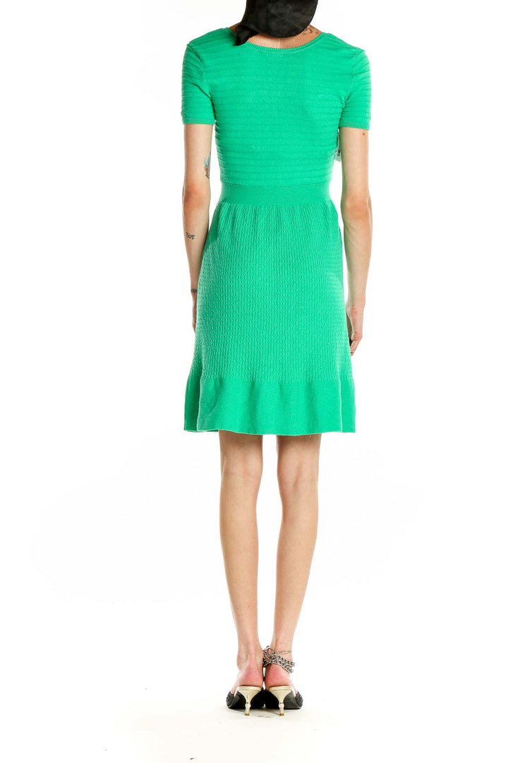 Side view of Cynthia Rowley green ribbed knit fit-and-flare dress