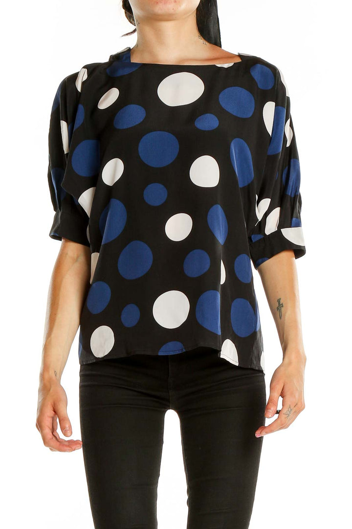 Front view of MICHAEL Michael Kors black blouse with blue and white polka dots