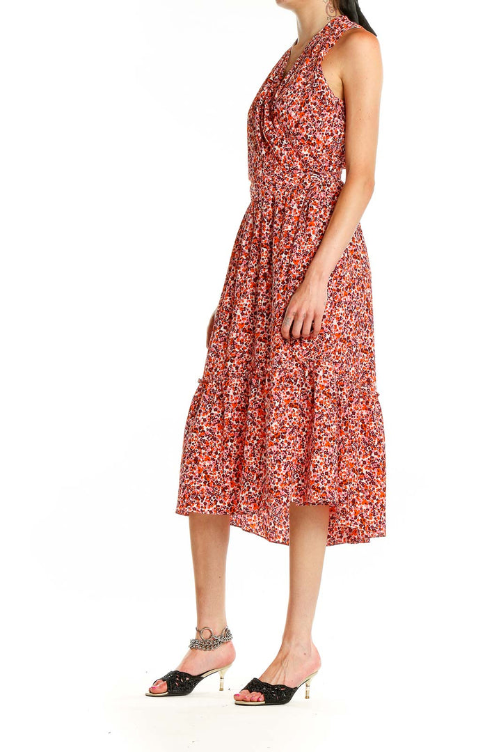 Front view of London Times red floral halter midi dress with tiered skirt