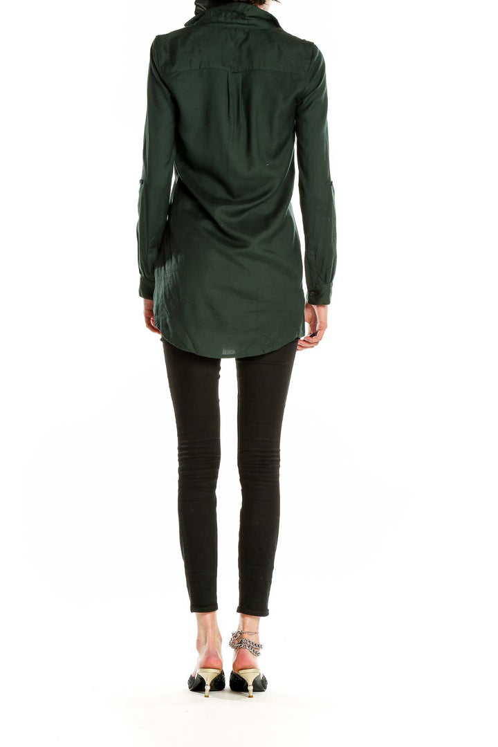Side view of forest green V-neck tunic top by Sparkle & Fade on model