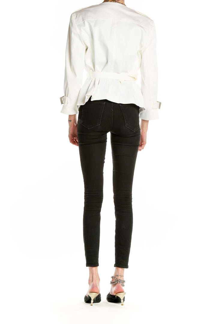 Back view of Calvin Klein white double-breasted jacket on model