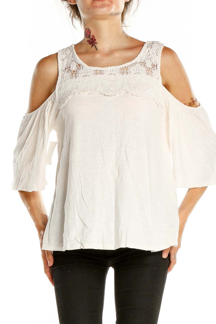 Front view of Sanctuary white lace cold shoulder blouse with fluttery sleeves