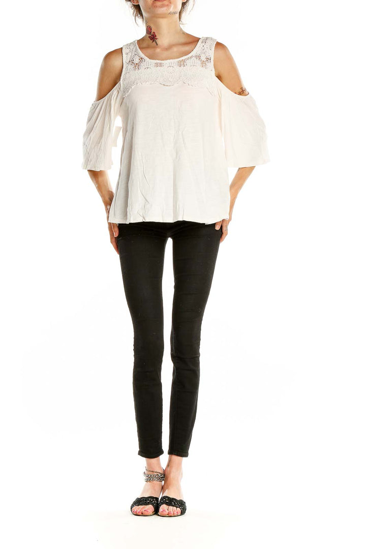 Front view of Sanctuary white lace cold shoulder blouse with fluttery sleeves
