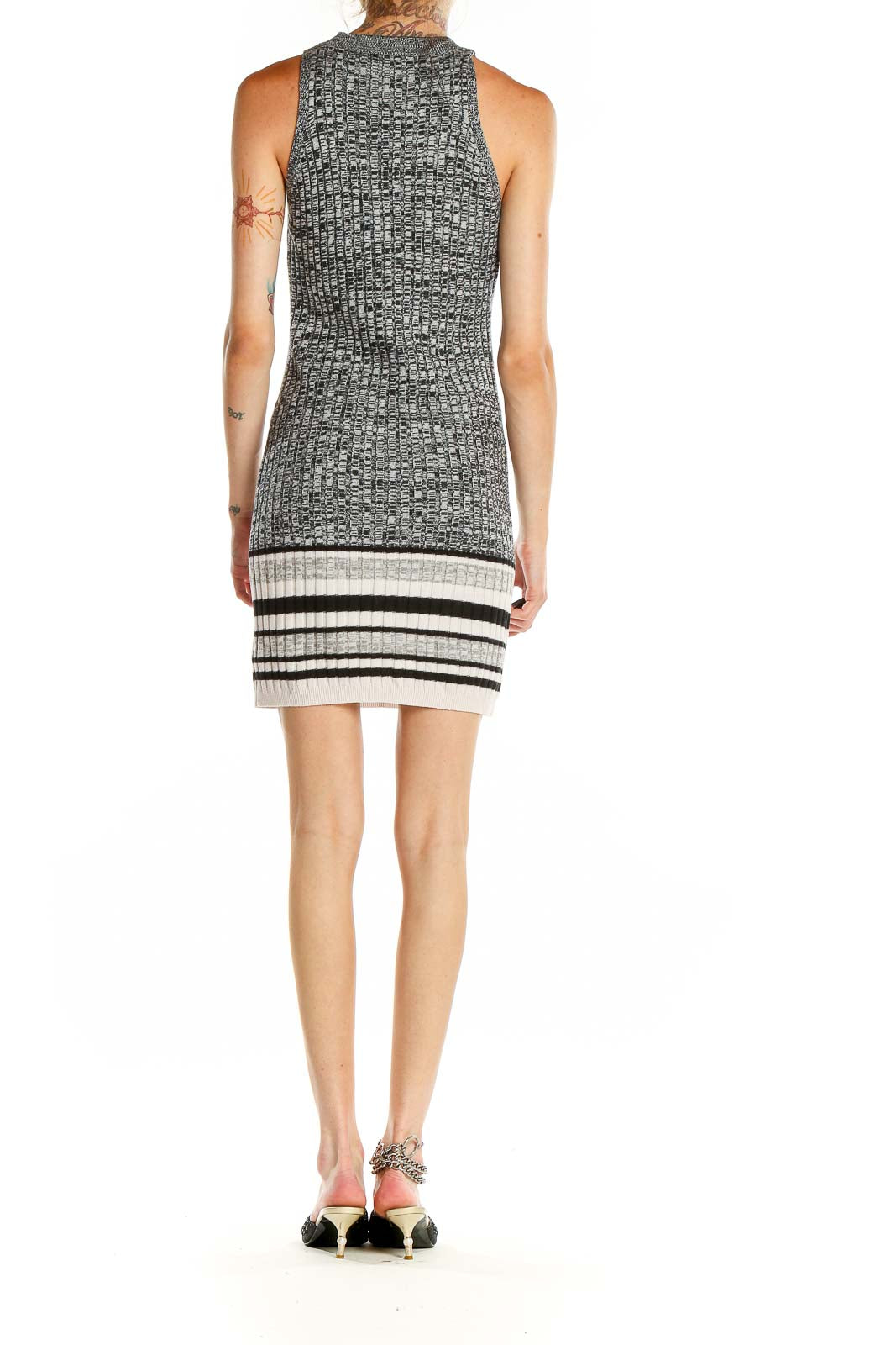 Side view of gray ribbed sleeveless bodycon dress showing striped hem detail