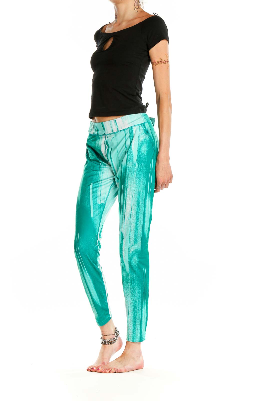 Front view of teal tie-dye Under Armour athletic leggings