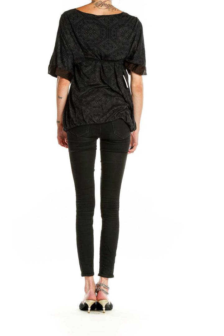 Back view of Ella Moss black patterned empire waist top with rolled sleeves