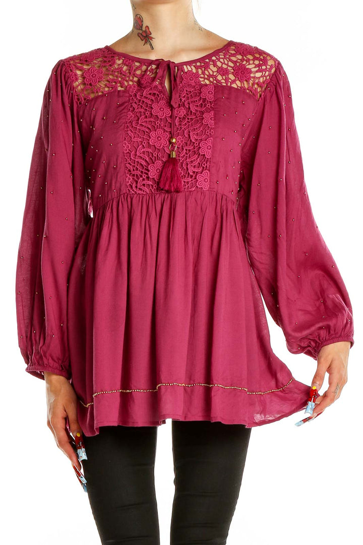 Front view of burgundy Free People tunic top with lace yoke and balloon sleeves