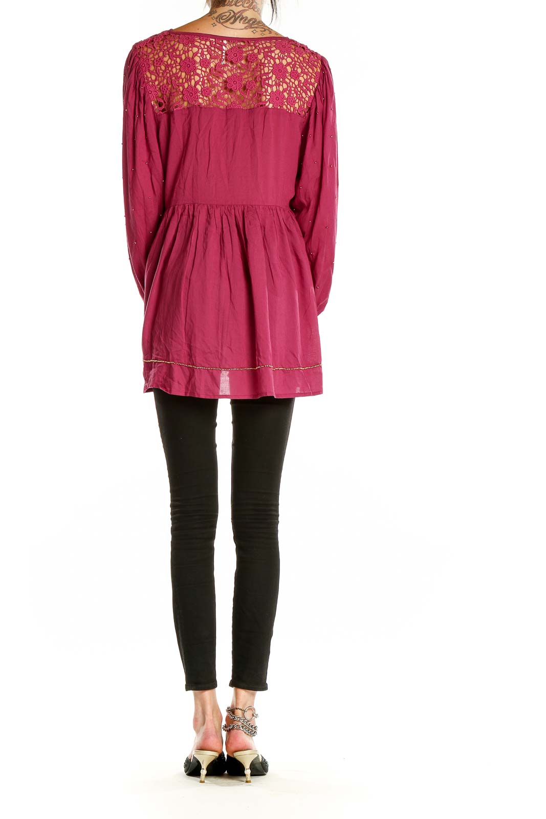 Back view of burgundy Free People tunic top showing lace yoke and flowy silhouette