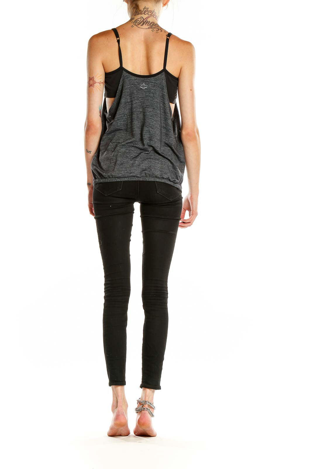 Side view of gray pleated racerback tank top from Beyond Yoga showing open back design