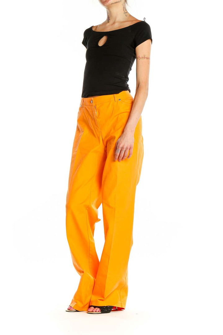 Front view of orange ESCADA wide-leg trousers on model
