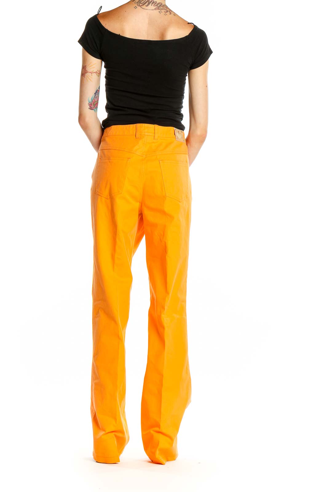 Side view of orange ESCADA wide-leg trousers on model with black top