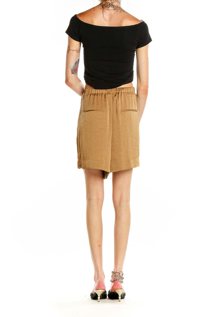 Back view of tan Vince relaxed fit shorts showing back pockets