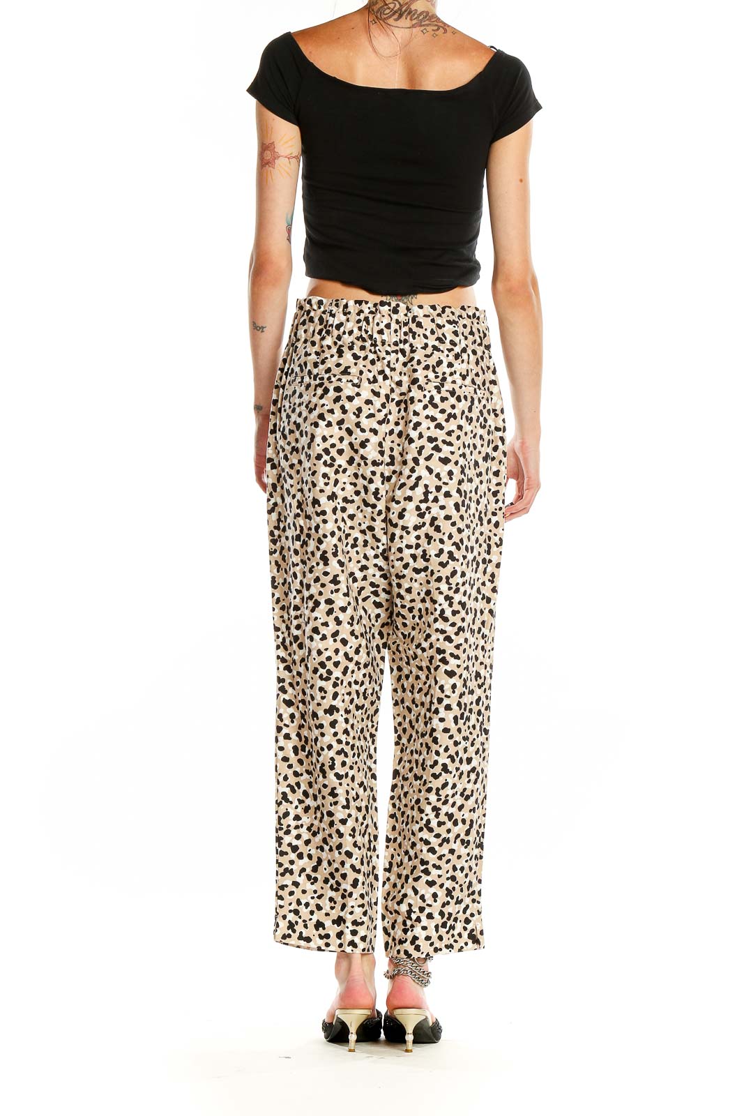 Back view of Ann Taylor beige leopard print wide-leg pants on model