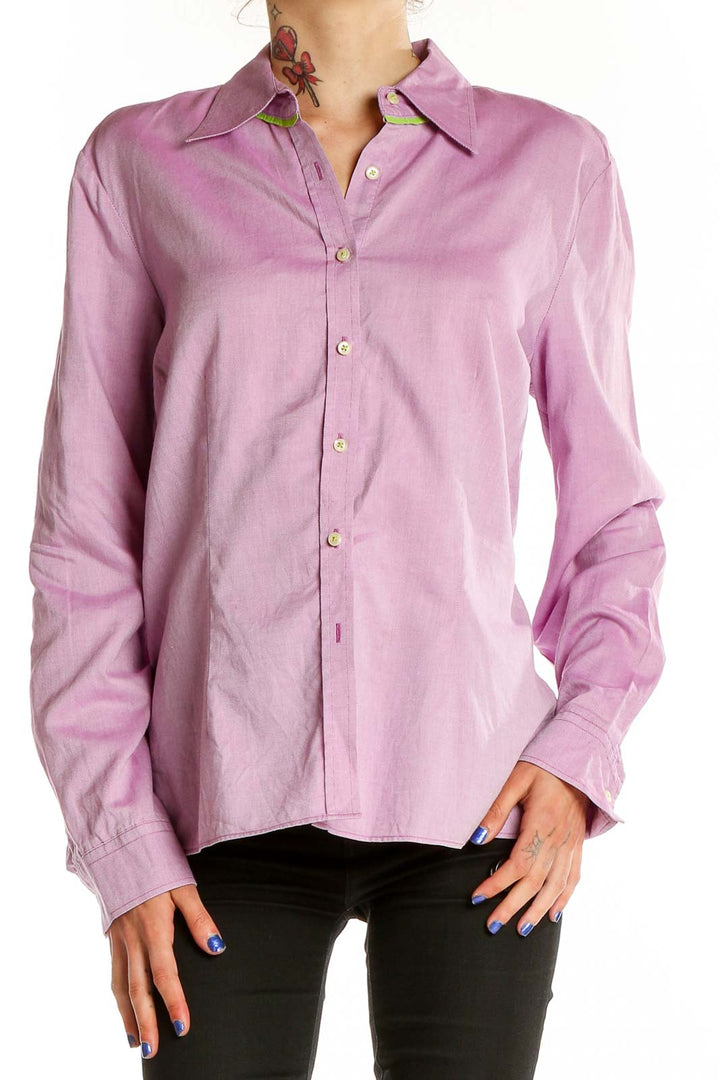 Front view of pink Tommy Hilfiger button-down shirt on model