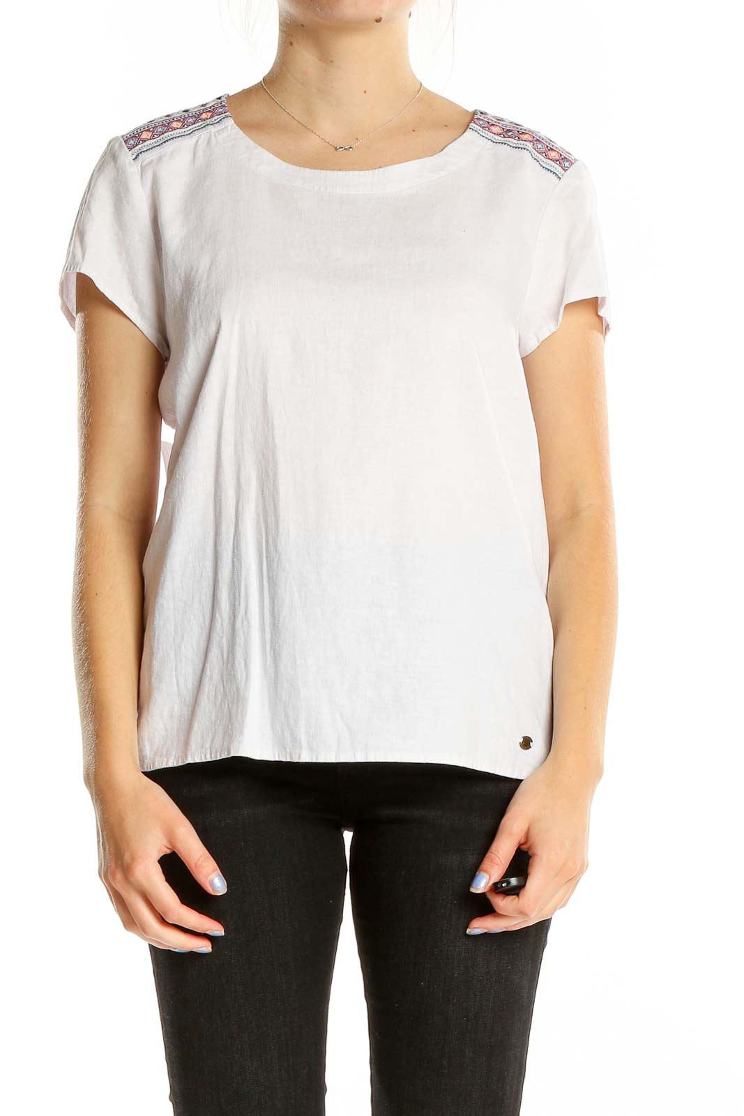 Front view of white Sherpa Adventure Gear top with embroidered shoulders