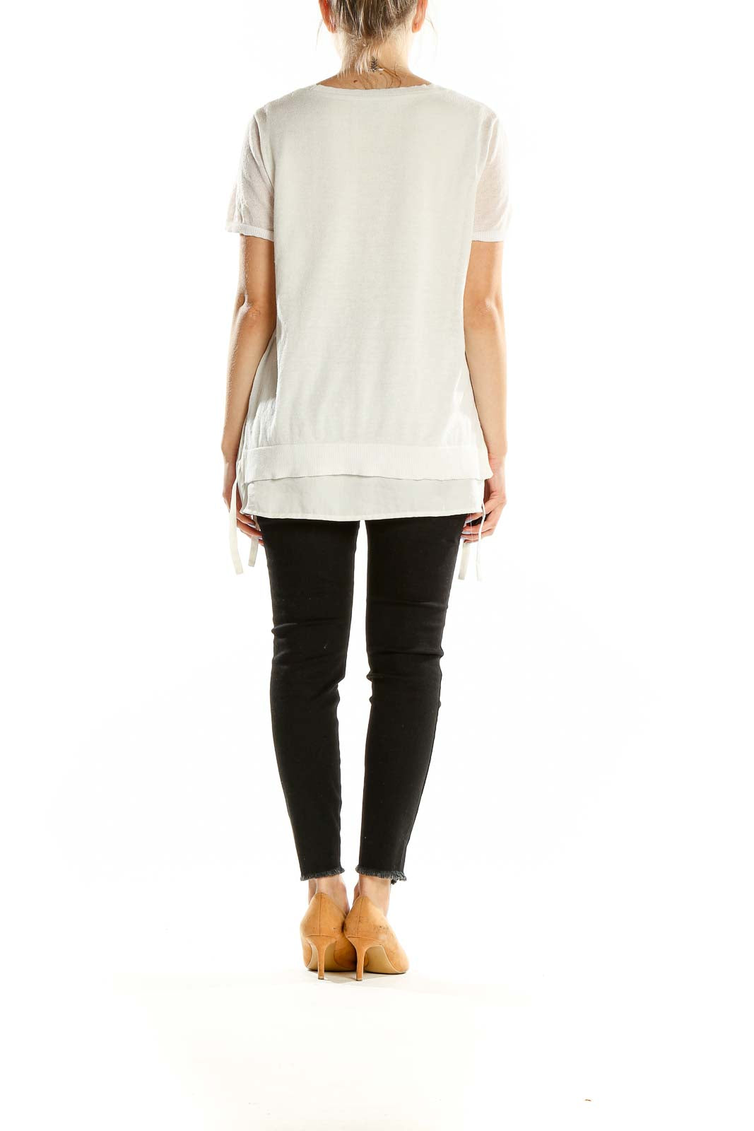 Back view of DKNY white layered top showing relaxed fit