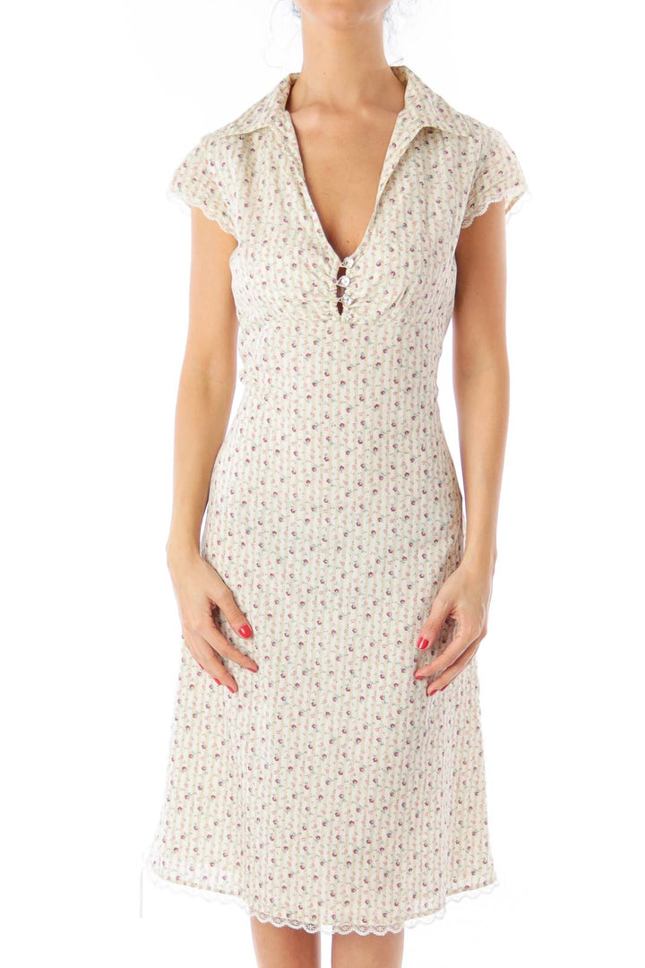 Front view of cream floral print midi dress from Free People with V-neckline and cap sleeves