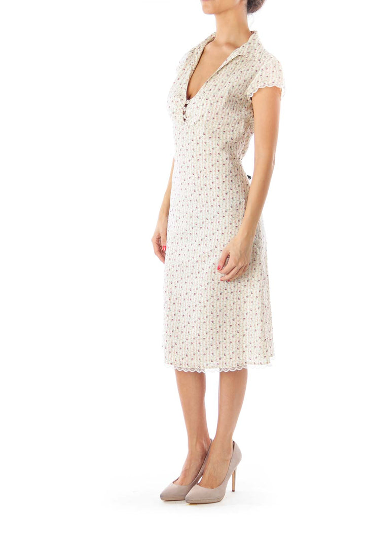 Front view of cream floral print midi dress from Free People with V-neckline and cap sleeves