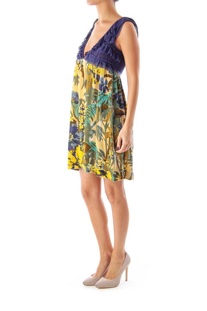 Front view of Free People navy and yellow floral mini dress with ruffled V-neckline