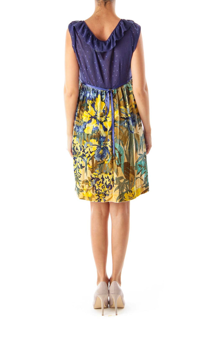 Back view of Free People navy and yellow floral mini dress showing ruffled shoulders