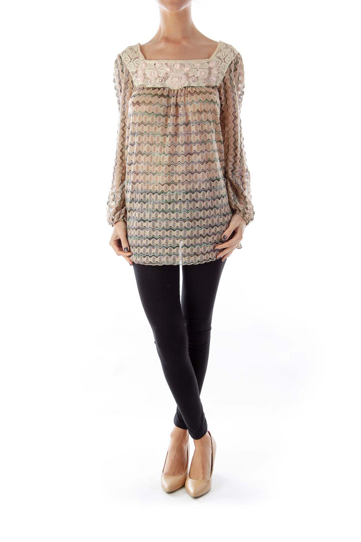 Front view of Free People beige tunic top with crochet lace and wavy pastel pattern