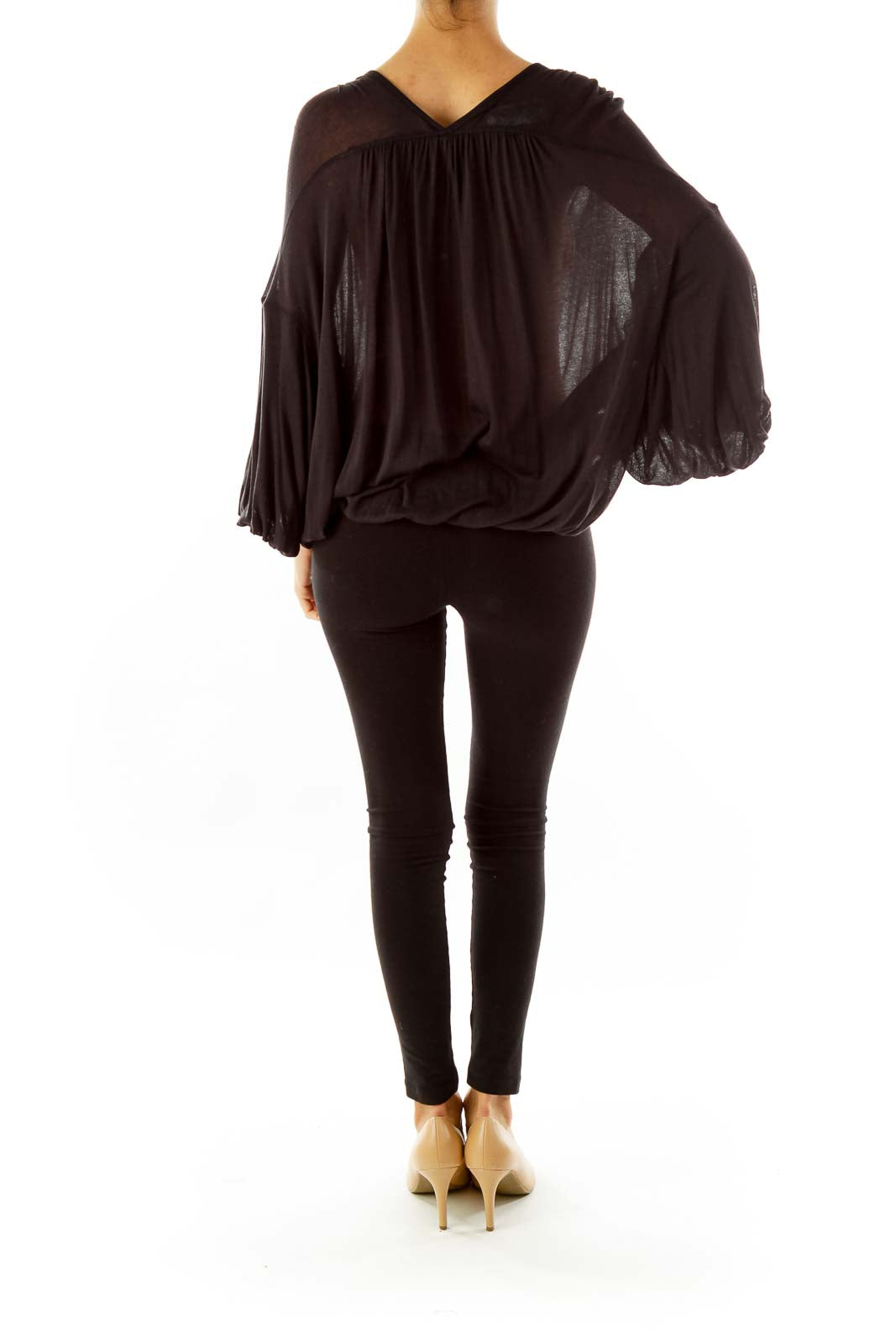 Back view of black Free People flowy top showing draped silhouette