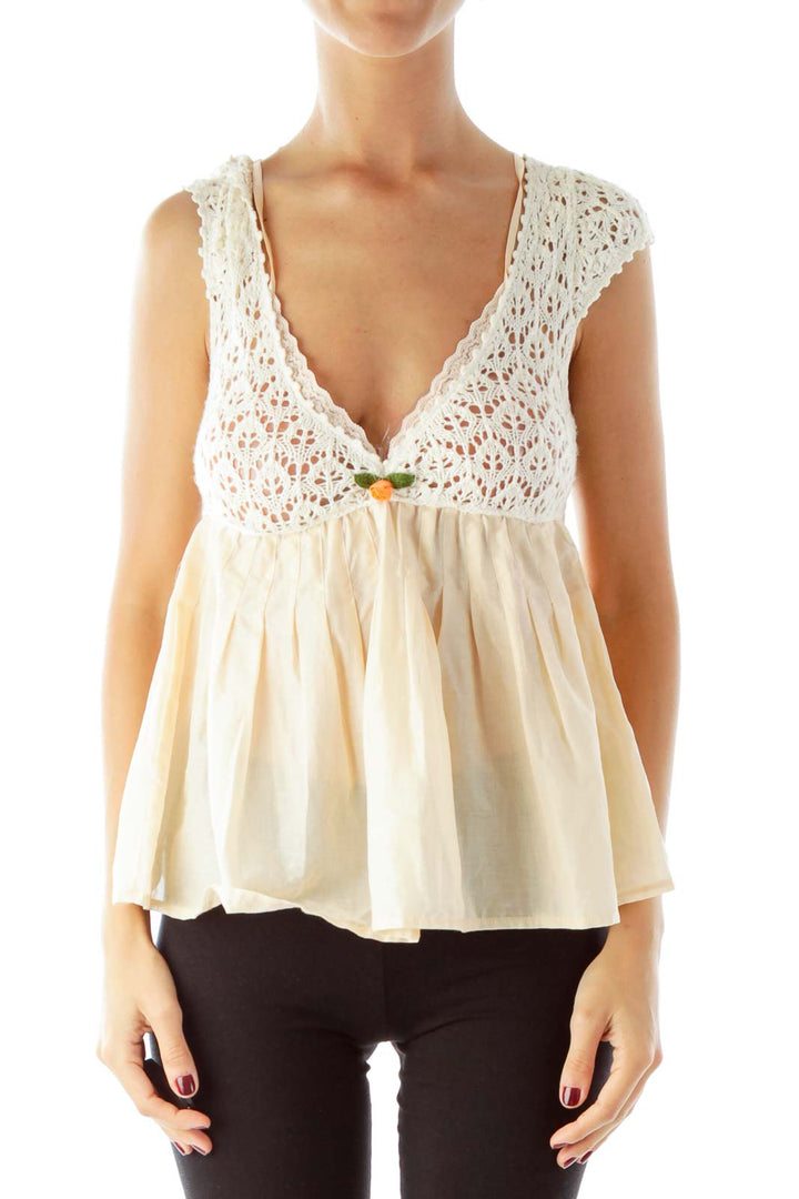 Front view of Free People cream crochet babydoll tank top with V-neckline