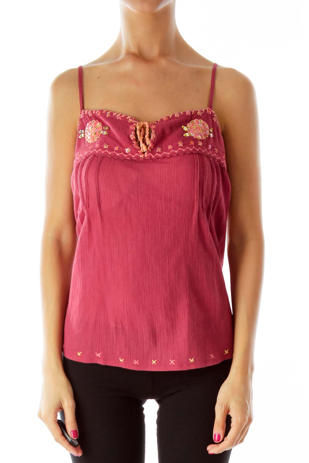 Front view of pink Free People camisole top with floral embroidery