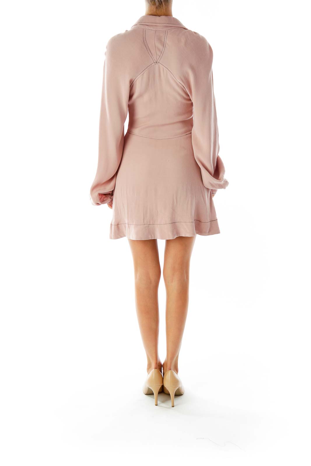 Back view of Free People blush mini dress showing long sleeves and flowy silhouette