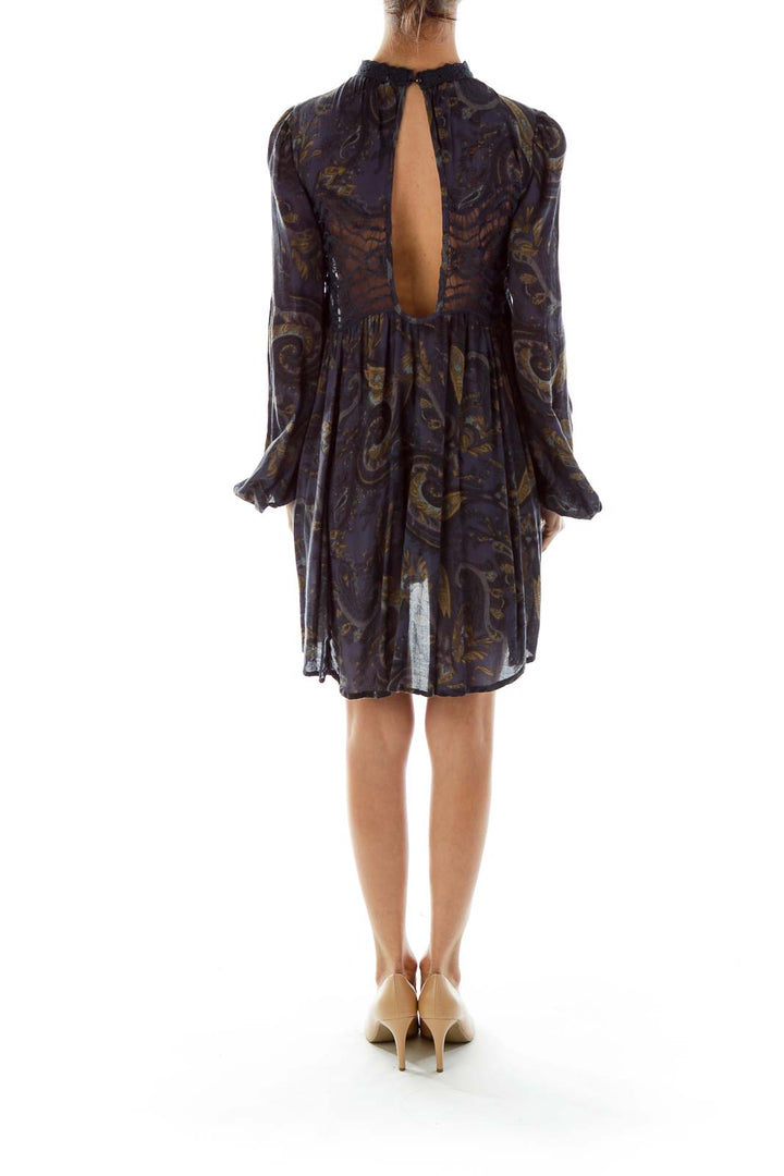 Back view of Free People navy mini dress showing keyhole closure and flowy silhouette