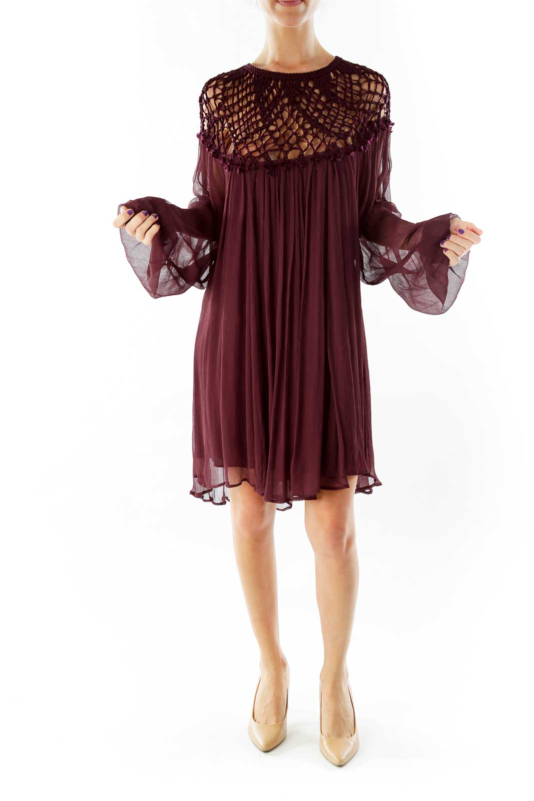 Front view of burgundy Free People dress with crochet yoke and flowy silhouette