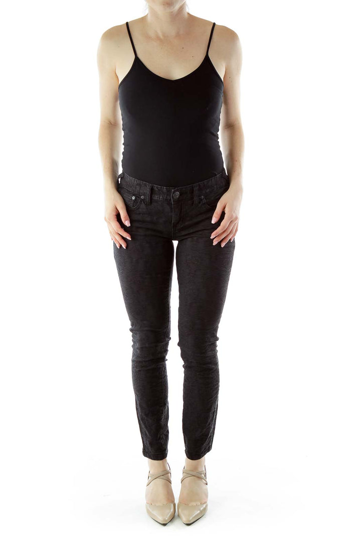 Front view of Free People black textured skinny pants on model