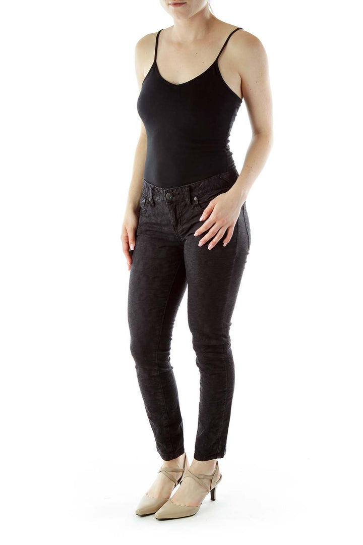 Front view of Free People black textured skinny pants on model