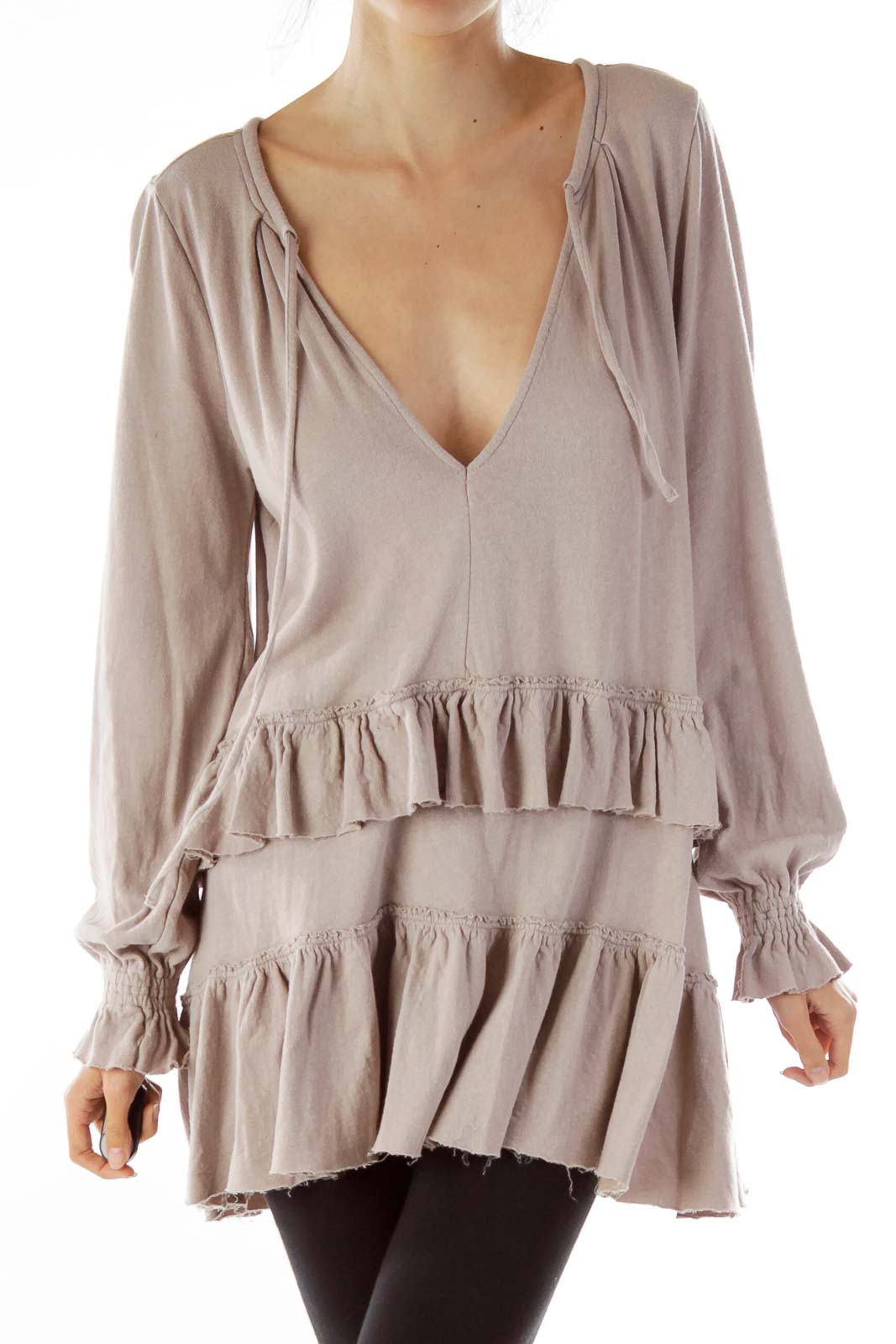 Front view of taupe Free People ruffled tunic top with V-neck and tiered ruffles