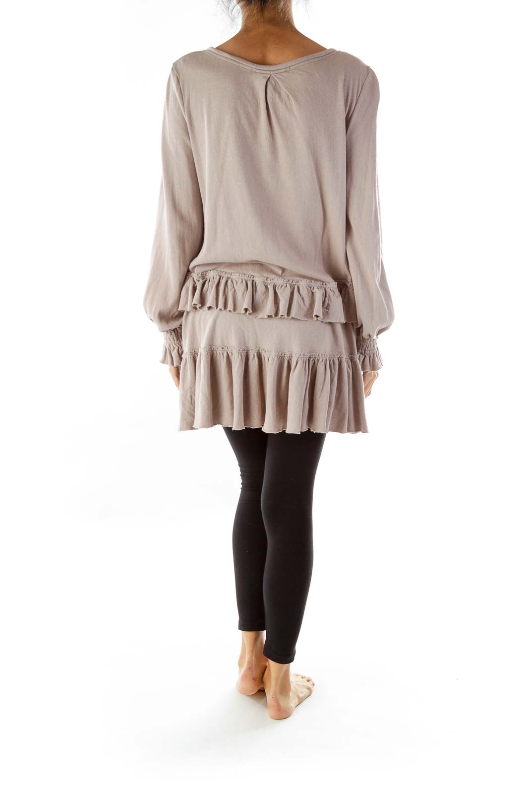 Back view of taupe Free People ruffled tunic top showing flowy silhouette and long sleeves