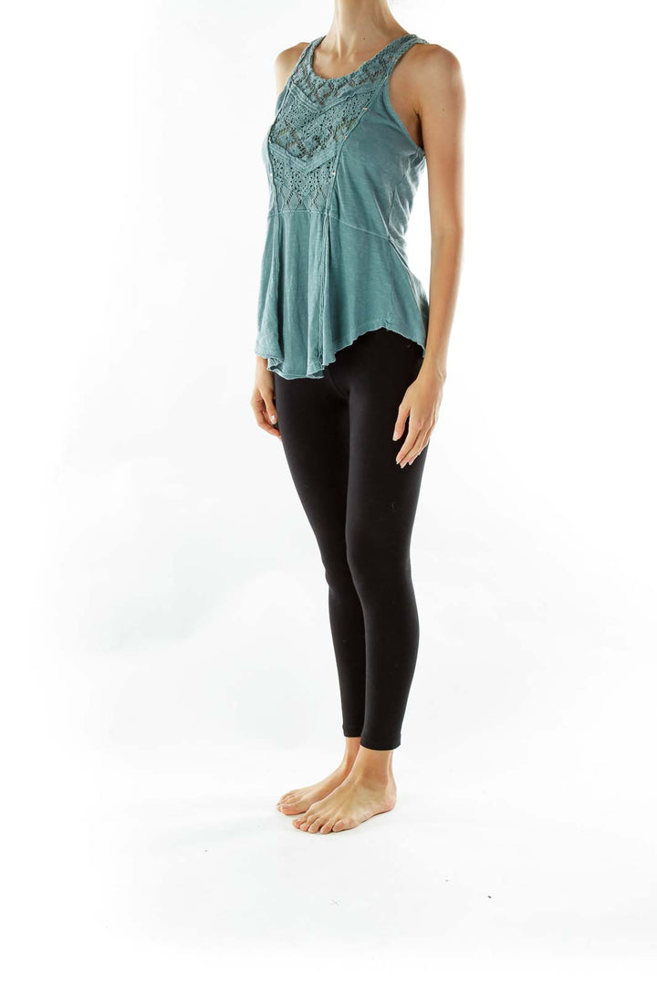 Front view of teal Free People peplum tank top with lace detailing