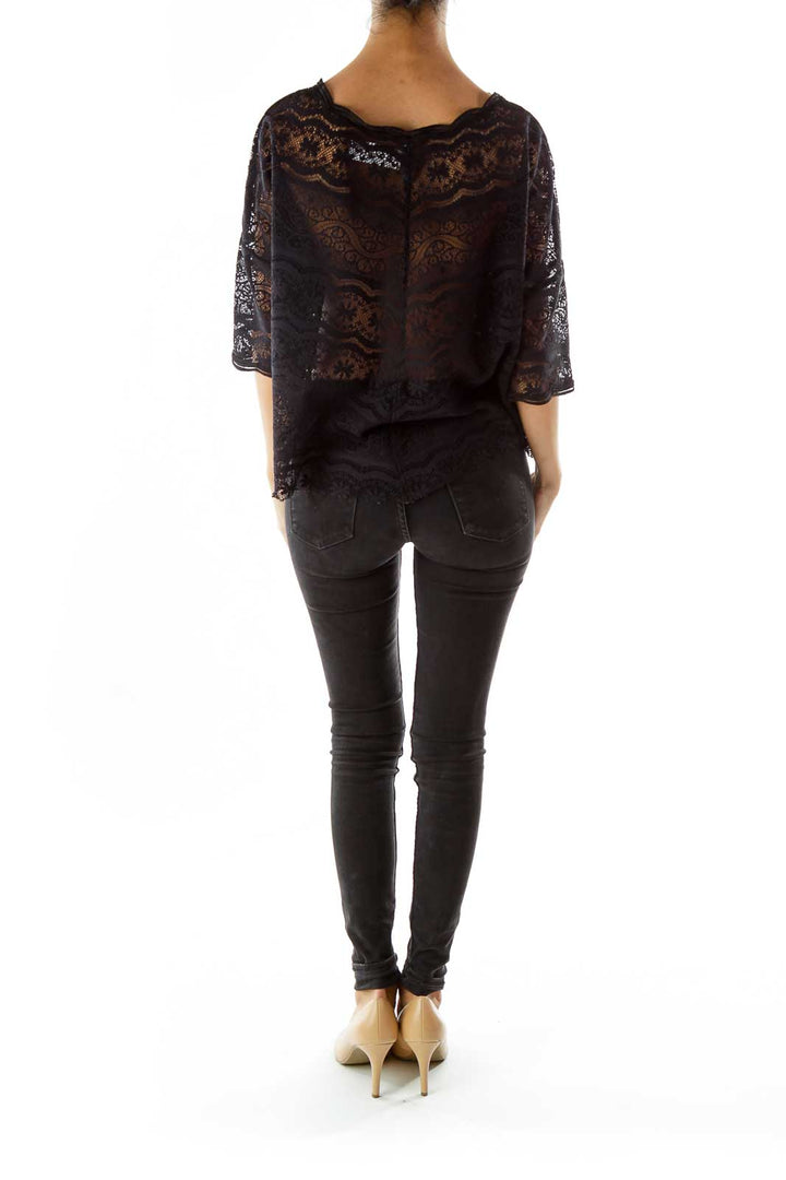 Back view of Free People black lace sheer overlay top on model