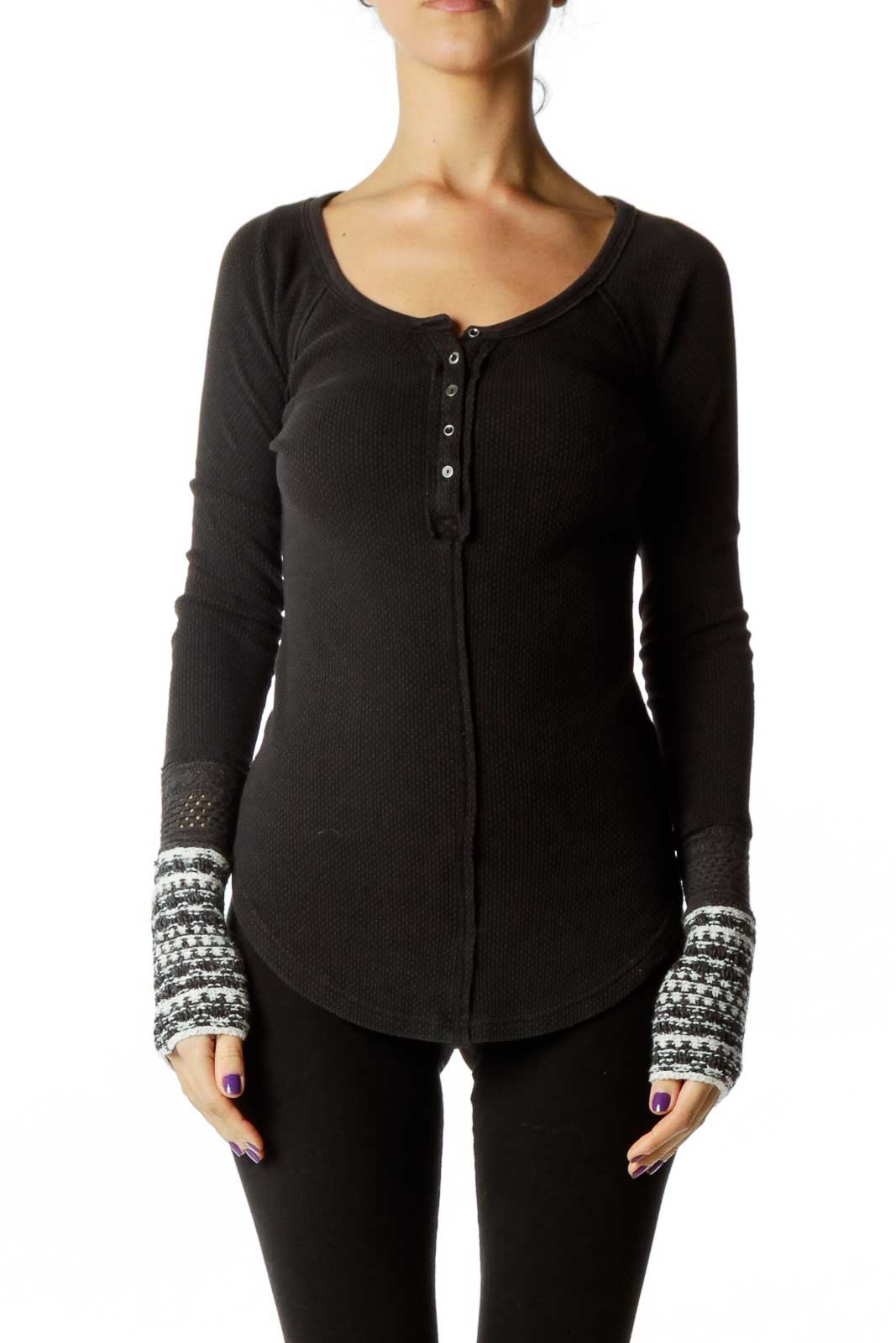 Front view of Free People black thermal henley top with patterned cuffs