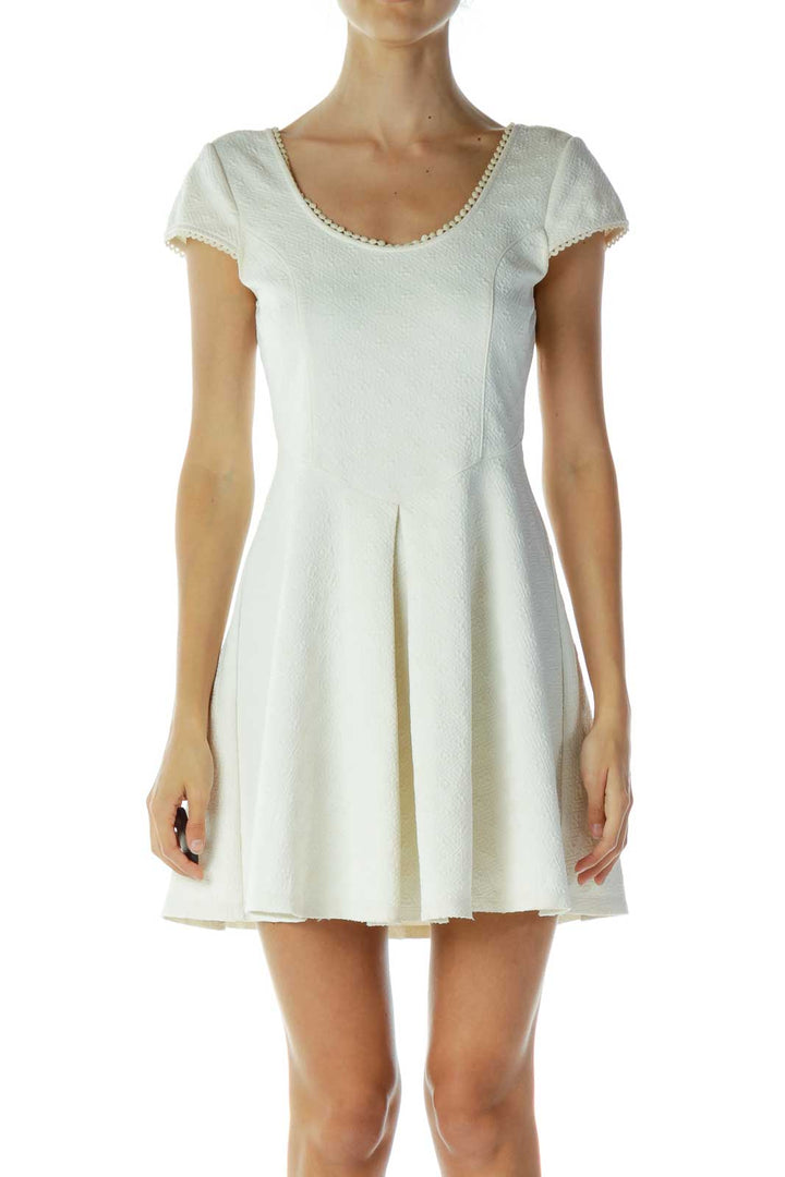 Front view of white textured cap sleeve mini dress by Free People